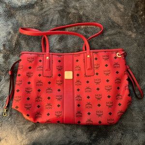 MCM Red Shoulder Bag includes mini shoulder/wrist red bag.